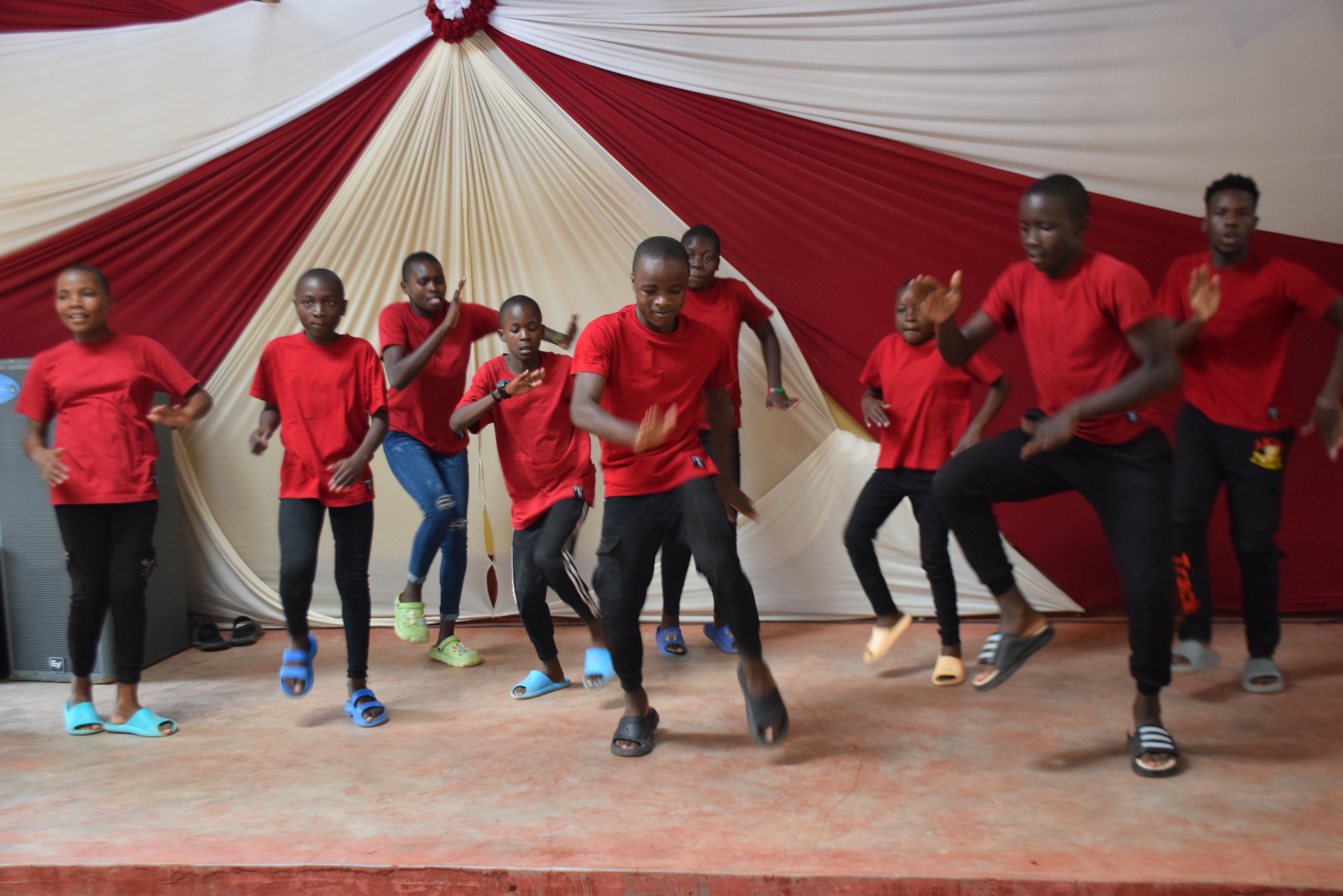 Children dancing and participating with enthusiasm