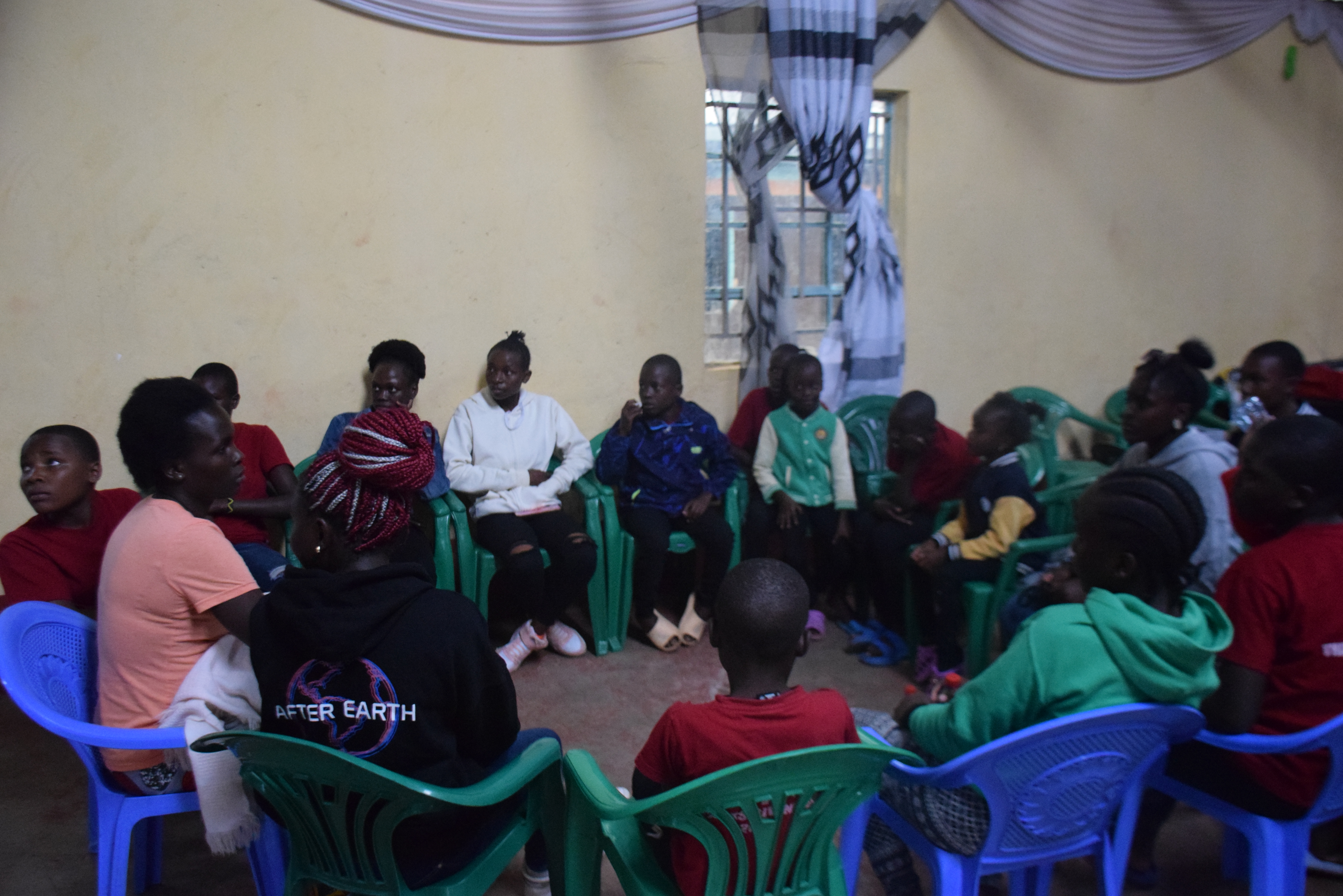 A volunteer facilitates a gender-specific talk