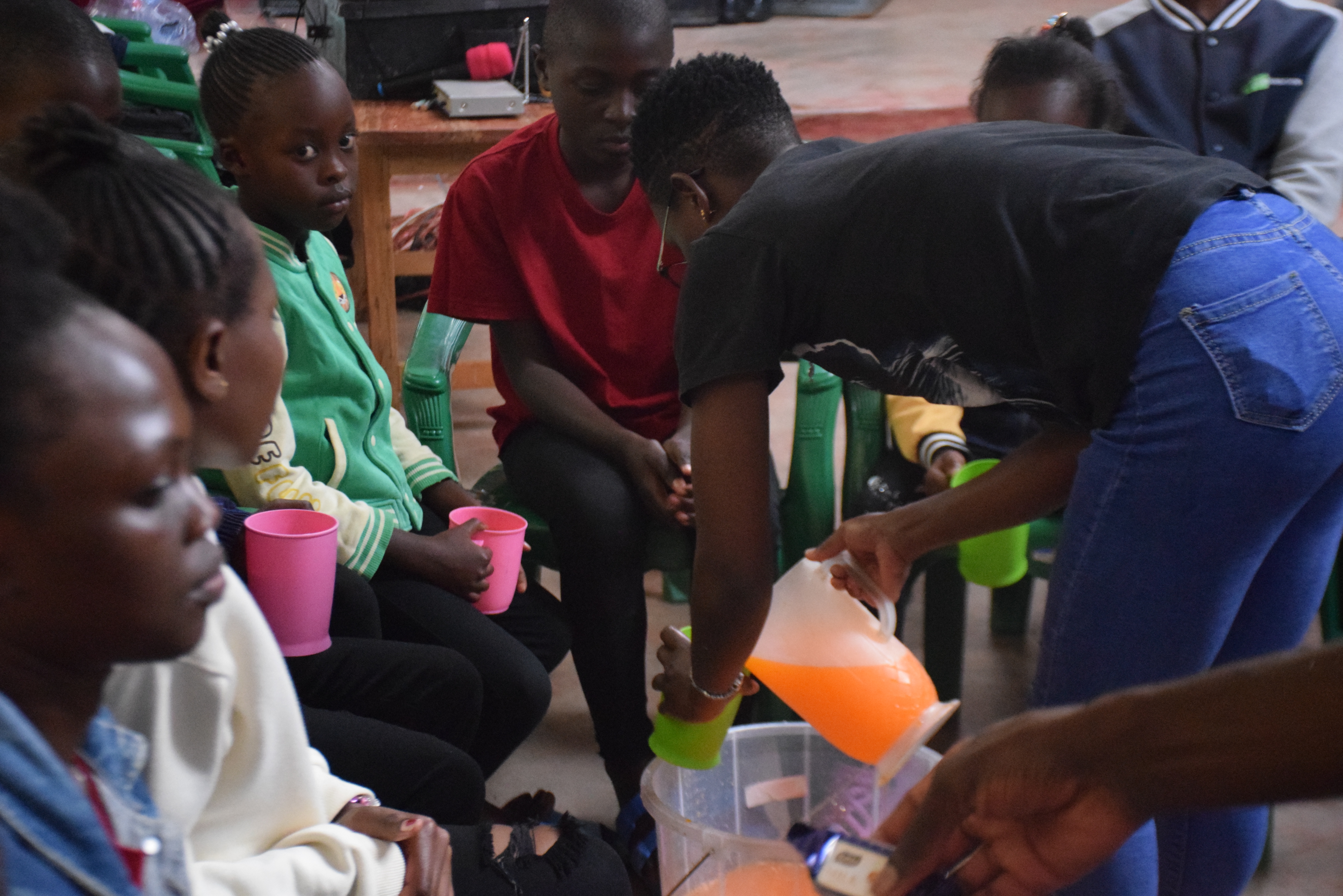The team and children share a hearty lunch